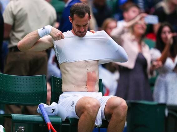Mandatory Credit: Photo by Javier Garcia Shutterstock (13002017hi) Andy Murray changes his shirt during his first round match Wimbledon Tennis Championships, Day 1, The All England Lawn Tennis and Croquet Club, London, UK - 27 Jun 2022 Wimbledon Tennis Championships, Day 1, The All England Lawn Tennis and Croquet Club, London, UK - 27 Jun 2022  Copyright: xJavierxGarcia Shutterstockx 13002017hi