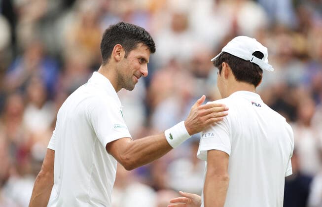 (220628) -- LONDON, June 28, 2022 -- Novak Djokovic (L) greets Kwon Soonwoo after the men s singles first round match between Novak Djokovic of Serbia and Kwon Soonwoo of South Korea at Wimbledon Tennis Championship in London, Britain, on June 27, 2022. ) (SP)BRITAIN-LONDON-TENNIS-WIMBLEDON-DAY 1 LixYing 