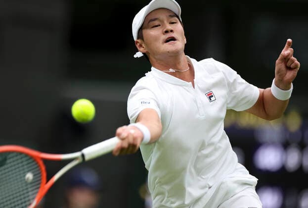 (220628) -- LONDON, June 28, 2022 -- Kwon Soonwoo hits a return during the men s singles first round match between Novak Djokovic of Serbia and Kwon Soonwoo of South Korea at Wimbledon Tennis Championship in London, Britain, on June 27, 2022. ) (SP)BRITAIN-LONDON-TENNIS-WIMBLEDON-DAY 1 HanxYan 