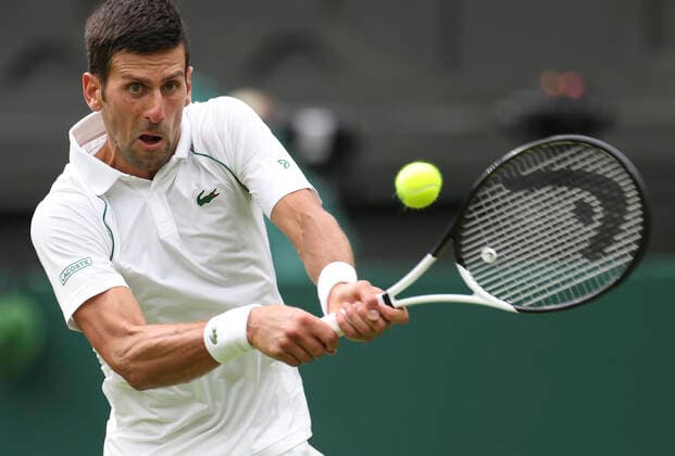 (220628) -- LONDON, June 28, 2022 -- Novak Djokovic hits a return during the men s singles first round match between Novak Djokovic of Serbia and Kwon Soonwoo of South Korea at Wimbledon Tennis Championship in London, Britain, on June 27, 2022. ) (SP)BRITAIN-LONDON-TENNIS-WIMBLEDON-DAY 1 HanxYan 
