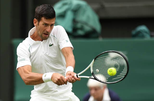 (220628) -- LONDON, June 28, 2022 -- Novak Djokovic hits a return during the men s singles first round match between Novak Djokovic of Serbia and Kwon Soonwoo of South Korea at Wimbledon Tennis Championship in London, Britain, on June 27, 2022. ) (SP)BRITAIN-LONDON-TENNIS-WIMBLEDON-DAY 1 HanxYan 