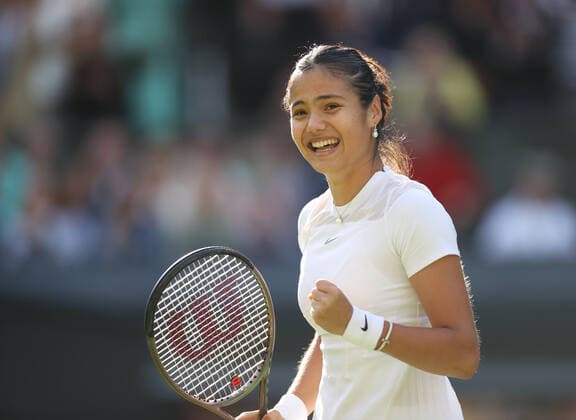 (220628) -- LONDON, June 28, 2022 -- Emma Raducanu celebrates after winning the women s singles first round match between Emma Raducanu of Britain and Alison Van Uytvanck of Belgium at Wimbledon Tennis Championship in London, Britain, on June 27, 2022. ) (SP)BRITAIN-LONDON-TENNIS-WIMBLEDON-DAY 1 LixYing 