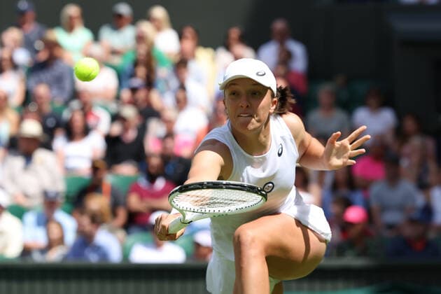28th June 2022, All England Lawn Tennis and Croquet Club, London, England; Wimbledon Tennis tournament; Iga Swiatek plays a volley to Jana Fett in the ladies singles  ActionPlus12402730 ShaunxBrooks