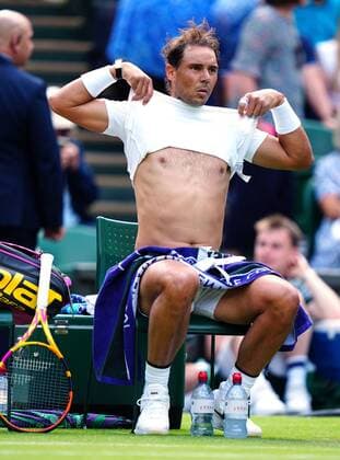 Mandatory Credit: Photo by Javier Garcia Shutterstock (13002021fa) Rafael Nadal changing his shirt during his first round match Wimbledon Tennis Championships, Day 2, The All England Lawn Tennis and Croquet Club, London, UK - 28 Jun 2022 Wimbledon Tennis Championships, Day 2, The All England Lawn Tennis and Croquet Club, London, UK - 28 Jun 2022  Copyright: xJavierxGarcia Shutterstockx 13002021fa
