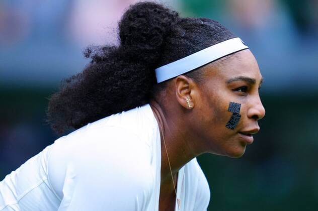 Mandatory Credit: Photo by Javier Garcia Shutterstock (13002021jz) Serena Williams sporting a plaster on her cheek and an earring that reads Loved during her first round match Wimbledon Tennis Championships, Day 2, The All England Lawn Tennis and Croquet Club, London, UK - 28 Jun 2022 Wimbledon Tennis Championships, Day 2, The All England Lawn Tennis and Croquet Club, London, UK - 28 Jun 2022  Copyright: xJavierxGarcia Shutterstockx 13002021jz