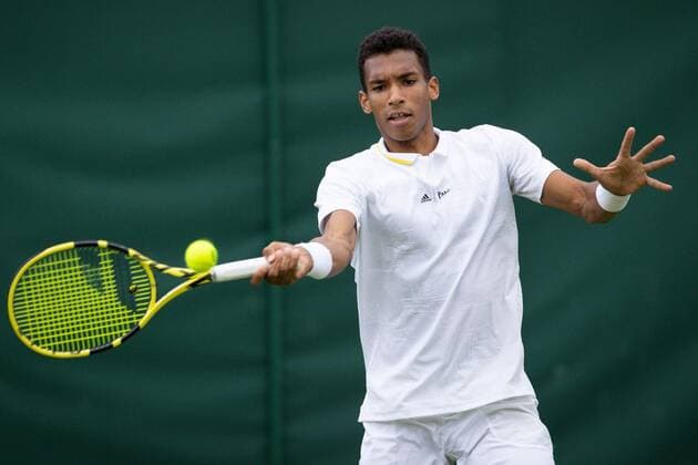 Mandatory Credit: Photo by Ella Ling Shutterstock (13002020ds) Felix Auger-Aliassime during his first round match Wimbledon Tennis Championships, Day 2, The All England Lawn Tennis and Croquet Club, London, UK - 28 Jun 2022 Wimbledon Tennis Championships, Day 2, The All England Lawn Tennis and Croquet Club, London, UK - 28 Jun 2022  Copyright: xEllaxLing Shutterstockx 13002020ds