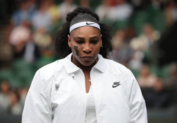 American Serena Williams walks on centre court in her first round match against France s Harmony Tan on day two of the 2022 Wimbledon championships in London on Tuesday, June 28, 2022.  LON2022062850 HUGOxPHILPOTT