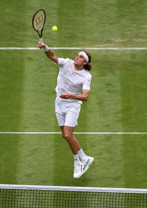 (220629) -- LONDON, June 29, 2022 -- Stefanos Tsitsipas competes during the men s singles first round match between Stefanos Tsitsipas of Greece and Alexander Ritschard of Switzerland at Wimbledon Tennis Championship in London, Britain, on June 28, 2022. ) (SP)BRITAIN-LONDON-TENNIS-WIMBLEDON-DAY 2 HanxYan 