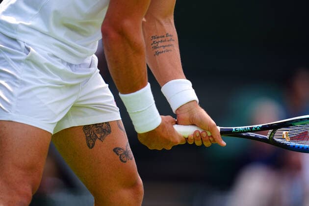 Mandatory Credit: Photo by Javier Garcia Shutterstock (13008249s) The tattoos of Thanasi Kokkinakis Wimbledon Tennis Championships, Day 3, The All England Lawn Tennis and Croquet Club, London, UK - 29 Jun 2022 Wimbledon Tennis Championships, Day 3, The All England Lawn Tennis and Croquet Club, London, UK - 29 Jun 2022  Copyright: xJavierxGarcia Shutterstockx 13008249s