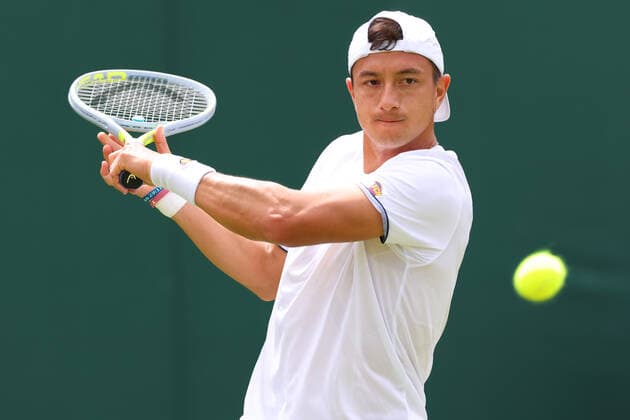 29th June 2022, All England Lawn Tennis and Croquet Club, London, England; Wimbledon Tennis tournament; Ryan Peniston plays a backhand to Steve Johnson  ActionPlus12402848 ShaunxBrooks