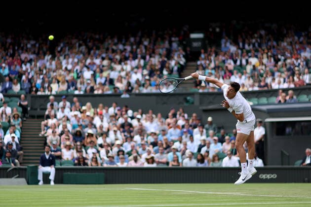 Sport Bilder des Tages 29th June 2022, All England Lawn Tennis and Croquet Club, London, England; Wimbledon Tennis tournament; Thanasi Kokkinakis serves to Novak Djokovic in the mens singles  ActionPlus12402909 ShaunxBrooks