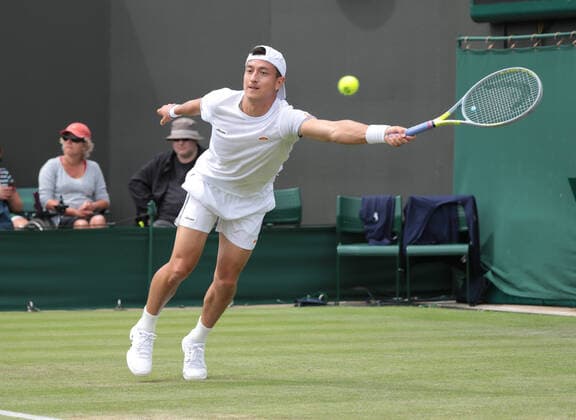 Great Britain s Ryan Peniston in action against American Steve Johnson on day three of the 2022 Wimbledon championships in London on Wednesday, June 29, 2022.  LON2022062908 HUGOxPHILPOTT