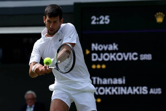29th June 2022, All England Lawn Tennis and Croquet Club, London, England; Wimbledon Tennis tournament; Novak Djokovic plays a backhand return to Thanasi Kokkinakis in the mens singles  ActionPlus12402871 ShaunxBrooks