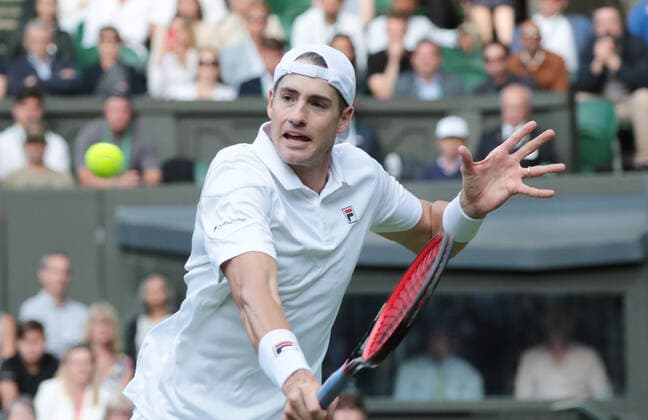 American John Isner in action against Great Britain s Andy Murray on day three of the 2022 Wimbledon championships in London on Wednesday, June 29,2022..  LON2022062956 HUGOxPHILPOTT