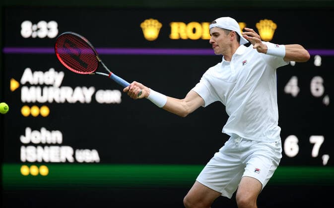 (220630) -- LONDON, June 30, 2022 -- John Isner of the United States hits a return during the men s singles 2nd round match against Andy Murray of Britain at Wimbledon Tennis Championship in London, Britain, June 29, 2022. ) (SP)BRITAIN-LONDON-TENNIS-WIMBLEDON LixYing 