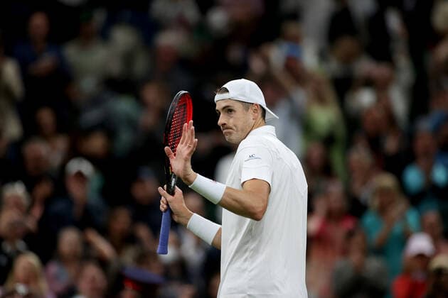 (220630) -- LONDON, June 30, 2022 -- John Isner of the United States reacts after the men s singles 2nd round match against Andy Murray of Britain at Wimbledon Tennis Championship in London, Britain, June 29, 2022. ) (SP)BRITAIN-LONDON-TENNIS-WIMBLEDON LixYing 