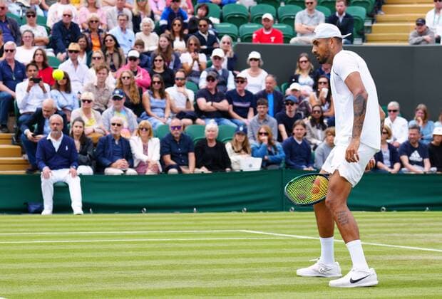 Mandatory Credit: Photo by Javier Garcia Shutterstock (13010731bq) Nick Kyrgios plays a shot through his legs during his second round match Wimbledon Tennis Championships, Day 4, The All England Lawn Tennis and Croquet Club, London, UK - 30 Jun 2022 Wimbledon Tennis Championships, Day 4, The All England Lawn Tennis and Croquet Club, London, UK - 30 Jun 2022  Copyright: xJavierxGarcia Shutterstockx 13010731bq