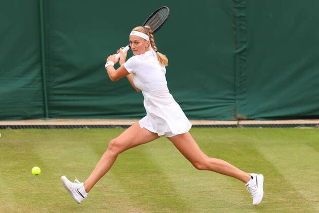 30th June 2022, All England Lawn Tennis and Croquet Club, London, England; Wimbledon Tennis tournament; Petra Kvitova plays a backhand to Ana Bogdan in the ladies singles  ActionPlus12403005 ShaunxBrooks
