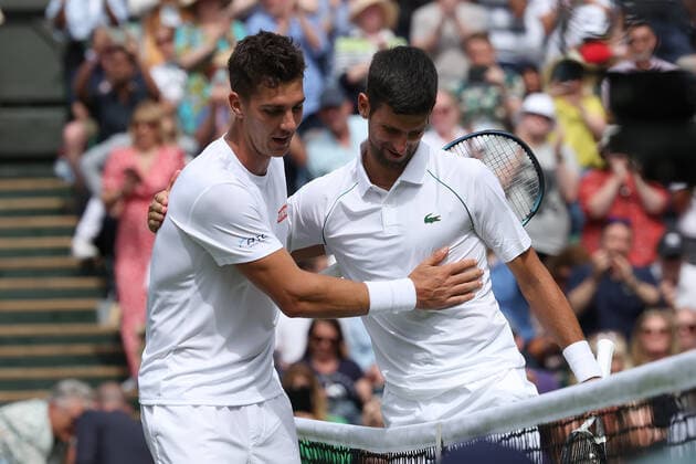 29th June 2022, All England Lawn Tennis and Croquet Club, London, England; Wimbledon Tennis tournament; Novak Djokovic shakes hands with Thanasi Kokkinakis after the 2 sets to 0 win in the mens singles  ActionPlus12403042 ShaunxBrooks