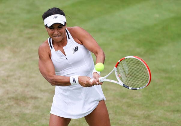 (220630) -- LONDON, June 30, 2022 -- Heather Watson of Britain hits a return during the women s singles second round match against Wang Qiang of China at Wimbledon tennis Championship in London, Britain, June 30, 2022. ) (SP)BRITAIN-LONDON-TENNIS-WIMBLEDON-WOMEN S SINGLES HanxYan 