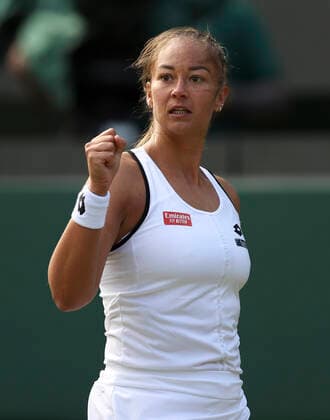 (220701) -- LONDON, July 1, 2022 -- Lesley Pattinama Kerkhove celebrates scoring during the women s singles second round match between Iga Swiatek of Poland and Lesley Pattinama Kerkhove of the Netherlands at Wimbledon Tennis Championship in London, Britain, on June 30, 2022. ) (SP)BRITAIN-LONDON-TENNIS-WIMBLEDON-WOMEN S SINGLES HanxYan 