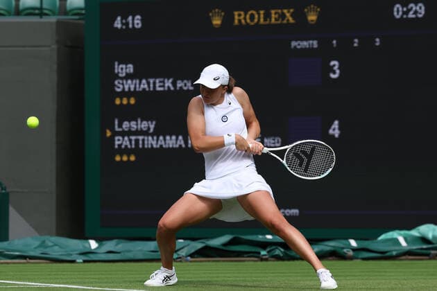 30th June 2022, All England Lawn Tennis and Croquet Club, London, England; Wimbledon Tennis tournament; Iga Swiatek plays a backhand to Lesley Pattinama Kerkhove in the ladies singles  ActionPlus12403330 ShaunxBrooks