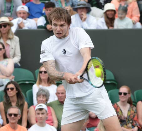 Kazakhstan s Alexander Bublik in action in his third round match against American Frances Tiafoe on day five of the 2022 Wimbledon championships in London on Friday, July 01, 2022. Tiafoe won the match 3-6,7-6,7-6,6-4.  LON2022070124 HUGOxPHILPOTT