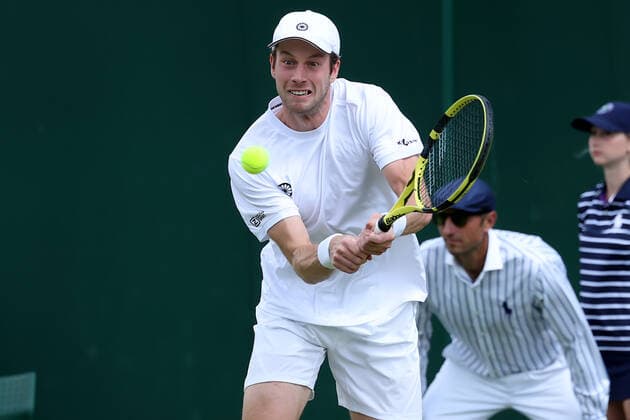 1st July 2022, All England Lawn Tennis and Croquet Club, London, England; Wimbledon Tennis tournament; Botic Van De Zandschulp plays a backhand to John Peers and Filip Polasek in the mens doubles  ActionPlus12403494 ShaunxBrooks