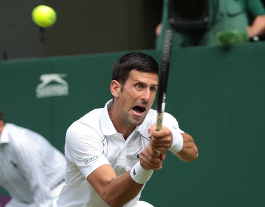 Serbian Novak Djokovic in action in his third round match against Serbian Miomir Kaomanovic on day five of the 2022 Wimbledon championships in London on Friday, July 01, 2022. Djokovic won the match 6-0,6-3,6-4.  LON202207033 HUGOxPHILPOTT
