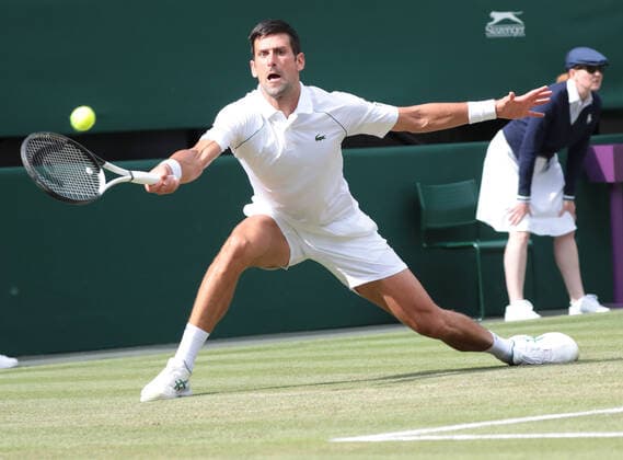 Serbian Novak Djokovic in action in his third round match against Serbian Miomir Kaomanovic on day five of the 2022 Wimbledon championships in London on Friday, July 01, 2022. Djokovic won the match 6-0,6-3,6-4.  LON202207046 HUGOxPHILPOTT
