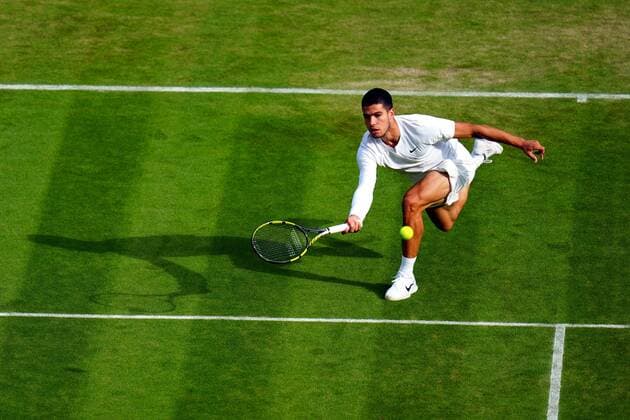 Mandatory Credit: Photo by Javier Garcia Shutterstock (13012399ey) Carlos Alcaraz during his third round match Wimbledon Tennis Championships, Day 5, The All England Lawn Tennis and Croquet Club, London, UK - 01 Jul 2022 Wimbledon Tennis Championships, Day 5, The All England Lawn Tennis and Croquet Club, London, UK - 01 Jul 2022  Copyright: xJavierxGarcia Shutterstockx 13012399ey