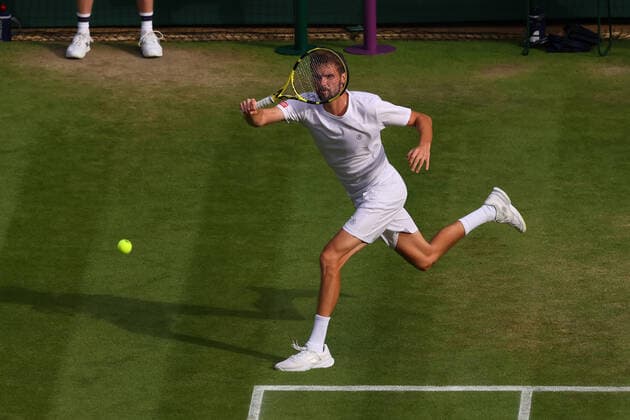 Ist July 2022, All England Lawn Tennis and Croquet Club, London, England; Wimbledon Tennis tournament; Oscar Otte plays a forehand to Carlos Alcaraz in the mens singles  ActionPlus12403745 ShaunxBrooks