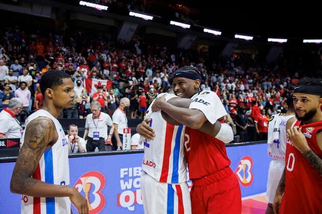 Basketball, WM Quali, Kanada - Dominikanische Republik July 1, 2022, Hamilton, ON, CANADA: Canada s Shai Gilgeous-Alexander (2) hugs Dominican Republic s Angel Delgado (12) after their FIBA international men s World Cup basketball qualifying game, in Hamilton, Ont., Friday, July 1, 2022. Canada News - July 1, 2022 - ZUMAc35_ 20220701_zaf_c35_291 Copyright: xColexBurstonx
