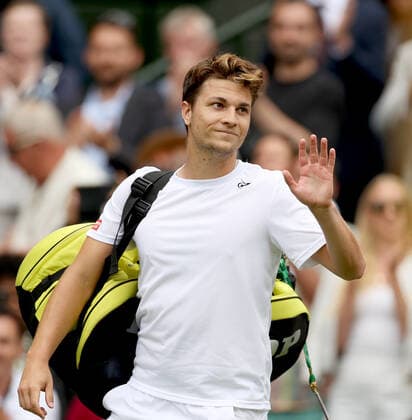 (220702) -- LONDON, July 2, 2022 -- Miomir Kecmanovic leaves the court after the men s singles third round match between Novak Djokovic of Serbia and Miomir Kecmanovic of Serbia at Wimbledon Tennis Championship in London, Britain, on July 1, 2022. ) (SP)BRITAIN-LONDON-TENNIS-WIMBLEDON-MEN S SINGLES LixYing 