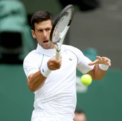 (220702) -- LONDON, July 2, 2022 -- Novak Djokovic hits a return during the men s singles third round match between Novak Djokovic of Serbia and Miomir Kecmanovic of Serbia at Wimbledon Tennis Championship in London, Britain, on July 1, 2022. ) (SP)BRITAIN-LONDON-TENNIS-WIMBLEDON-MEN S SINGLES LixYing 