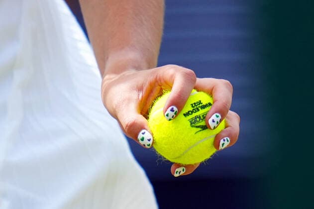 Mandatory Credit: Photo by Javier Garcia Shutterstock (13012408al) The painted fingernails of Katie Boulter holding a tennis ball during her third round match Wimbledon Tennis Championships, Day 6, The All England Lawn Tennis and Croquet Club, London, UK - 02 Jul 2022 Wimbledon Tennis Championships, Day 6, The All England Lawn Tennis and Croquet Club, London, UK - 02 Jul 2022  Copyright: xJavierxGarcia Shutterstockx 13012408al