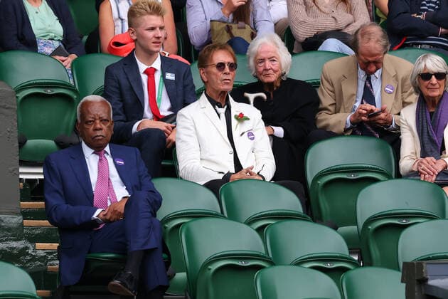 1st July 2022, All England Lawn Tennis and Croquet Club, London, England; Wimbledon Tennis tournament; Sir Cliff Richard and Trevor McDonald watch the action on centre court  ActionPlus12403825 ShaunxBrooks
