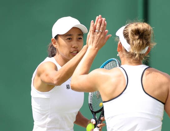 (220702) -- LONDON, July 2, 2022 -- Zhang Shuai (L) of China Elise Mertens of Belgium celebrate during the women s doubles 2nd round match against Viktorija Golubic of Switzerland Camila Osorio of Colombia at Wimbledon Tennis Championship in London, Britain, July 2, 2022. ) (SP)BRITAIN-LONDON-TENNIS-WIMBLEDON-WOMEN S DOUBLES LixYing 