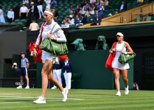 Mandatory Credit: Photo by James Veysey Shutterstock (13012407aw) Petra Kvitova and Paula Badosa walk on to Centre Court ahead of their third round match Wimbledon Tennis Championships, Day 6, The All England Lawn Tennis and Croquet Club, London, UK - 02 Jul 2022 Wimbledon Tennis Championships, Day 6, The All England Lawn Tennis and Croquet Club, London, UK - 02 Jul 2022  Copyright: xJamesxVeysey Shutterstockx 13012407aw