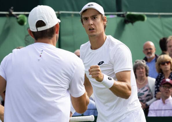 Belgian Joran Vliegen (R) and US Withrow react during a second round game in the men s doubles tournament between Belgian Vliegen - US Withrow and Australian Ebden - Australian Purcell at the 2022 Wimbledon grand slam tennis tournament at the All England Tennis Club, in south-west London, Britain, Saturday 02 July 2022. BENOITxDOPPAGNE  x36951531x