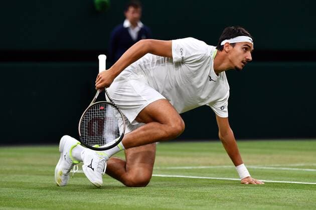 Mandatory Credit: Photo by James Veysey Shutterstock (13012407ds) Lorenzo Sonego slides to play a winner and ends up on his back during his third round match Wimbledon Tennis Championships, Day 6, The All England Lawn Tennis and Croquet Club, London, UK - 02 Jul 2022 Wimbledon Tennis Championships, Day 6, The All England Lawn Tennis and Croquet Club, London, UK - 02 Jul 2022  Copyright: xJamesxVeysey Shutterstockx 13012407ds