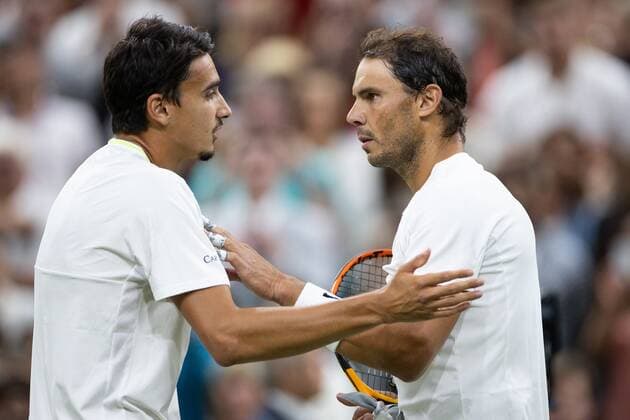 Mandatory Credit: Photo by Ella Ling Shutterstock (13012401fd) Rafael Nadal talks with Lorenzo Sonego at the net after winning his 3rd round match Wimbledon Tennis Championships, Day 6, The All England Lawn Tennis and Croquet Club, London, UK - 02 Jul 2022 Wimbledon Tennis Championships, Day 6, The All England Lawn Tennis and Croquet Club, London, UK - 02 Jul 2022  Copyright: xEllaxLing Shutterstockx 13012401fd