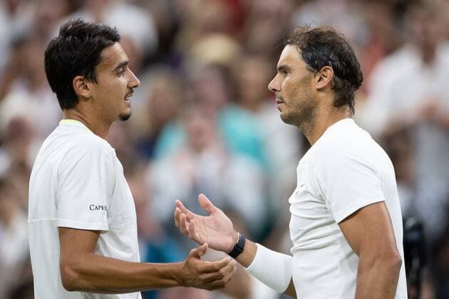 Mandatory Credit: Photo by Ella Ling Shutterstock (13012401fc) Rafael Nadal talks with Lorenzo Sonego at the net after winning his 3rd round match Wimbledon Tennis Championships, Day 6, The All England Lawn Tennis and Croquet Club, London, UK - 02 Jul 2022 Wimbledon Tennis Championships, Day 6, The All England Lawn Tennis and Croquet Club, London, UK - 02 Jul 2022  Copyright: xEllaxLing Shutterstockx 13012401fc