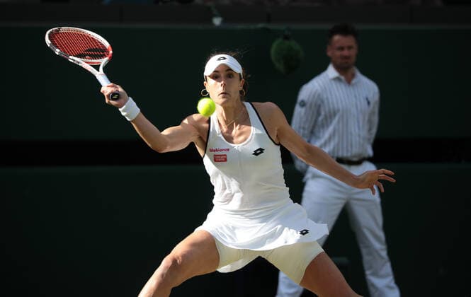 French Alize Cornet in action in her third round match against Polish Iga Swiatek on day six of the 2022 Wimbledon championships in London on Saturday, July 02, 2022.Cornet won the match 6-4,6-2.  LON2022070260 HUGOxPHILPOTT