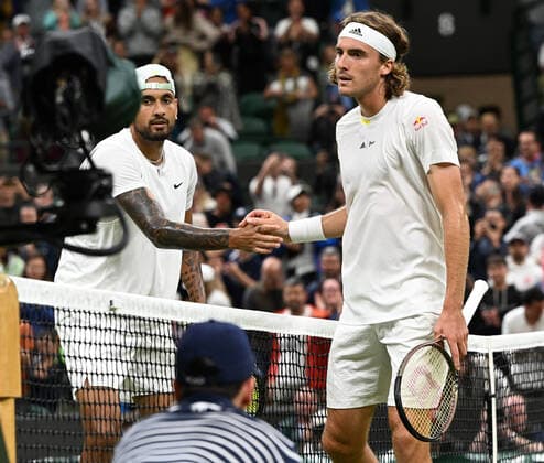 Tennis Championships - Week One - Day Six (Saturday) - All England Lawn Tennis Club, Wimbledon - Saturday 2nd July 2022 Nick Kyrgios v Stefanos Tsitsipas Nick Kyrgios with Tsitsipas at the net after winning match point 