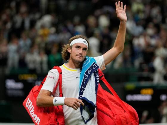 Mandatory Credit: Photo by Dave Shopland Shutterstock (13012402jl) Stefanos Tsitsipas waves to the crowd after losing his third round match Wimbledon Tennis Championships, Day 6, The All England Lawn Tennis and Croquet Club, London, UK - 02 Jul 2022 Wimbledon Tennis Championships, Day 6, The All England Lawn Tennis and Croquet Club, London, UK - 02 Jul 2022  Copyright: xDavexShopland Shutterstockx 13012402jl