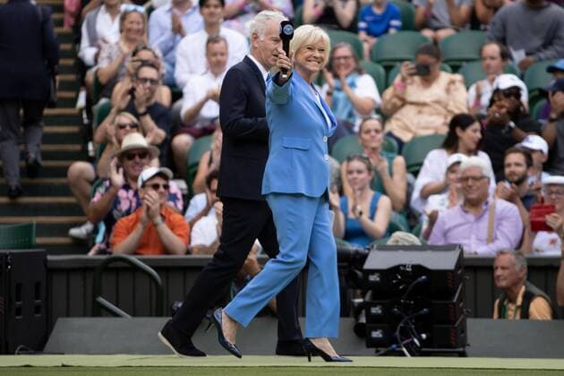 Mandatory Credit: Photo by Ella Ling Shutterstock (13012853g) Sue Barker and John McEnroe walk onto Centre Court to host the centenary celebrations Wimbledon Tennis Championships, Day 7, The All England Lawn Tennis and Croquet Club, London, UK - 03 Jul 2022 Wimbledon Tennis Championships, Day 7, The All England Lawn Tennis and Croquet Club, London, UK - 03 Jul 2022  Copyright: xEllaxLing Shutterstockx 13012853g