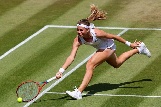 3rd July 2022, All England Lawn Tennis and Croquet Club, London, England; Wimbledon Tennis tournament; Marie Bouzkova plays a volley at the net against Caroline Garcia in the ladies singles  ActionPlus12404410 ShaunxBrooks