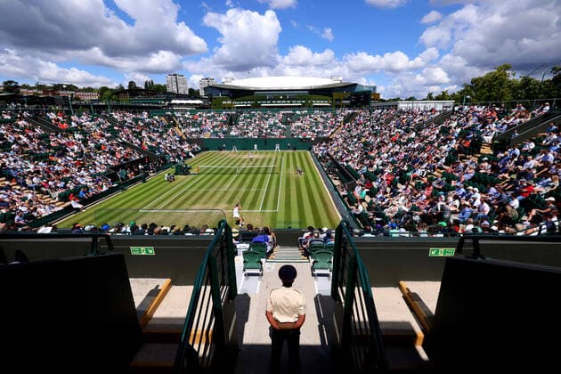 3rd July 2022, All England Lawn Tennis and Croquet Club, London, England; Wimbledon Tennis tournament; A military steward observes the match between Marie Bouzkova and Caroline Garcia in the ladies singles  ActionPlus12404416 ShaunxBrooks
