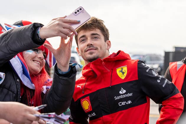 3rd July 2022, Silverstone Circuit, Silverstone, Northamptonshire, England: British F1 Grand Prix, Race day: Scuderia Ferrari driver Charles Leclerc poses for a selfie  ActionPlus12404495 TimxWilliams